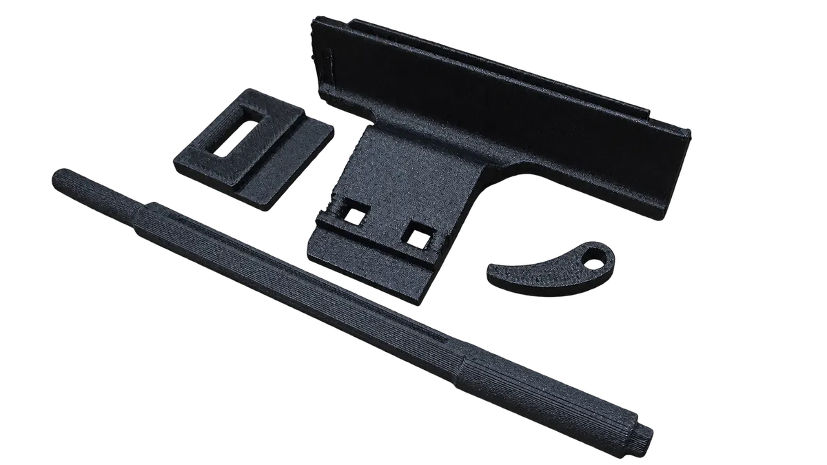Four reverse-engineered PA6-CF ice maker lever components for a fridge freezer