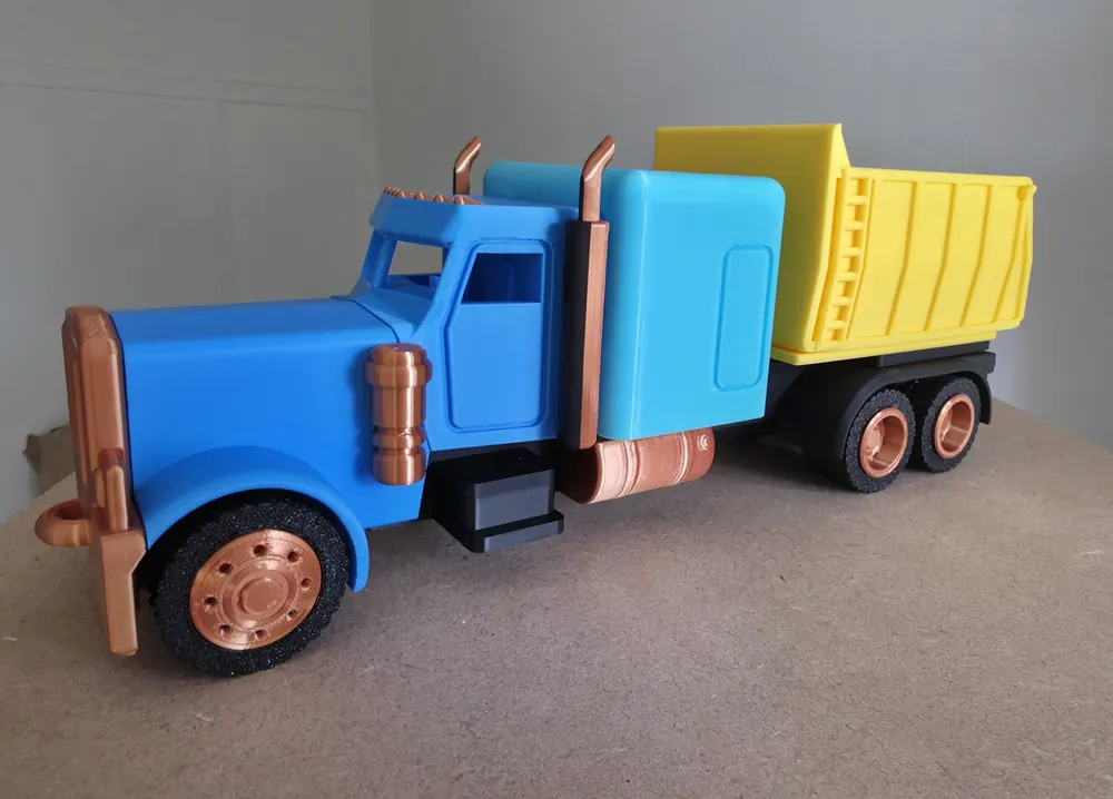 Blue and yellow custom 3D-printed dump truck