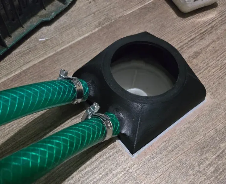 Custom 3D-printed hose drain adapter connected to two hoses